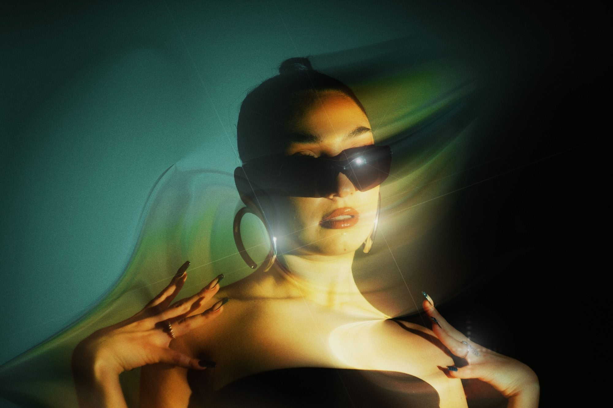 AXYRON — shield sunglasses in a studio light leak